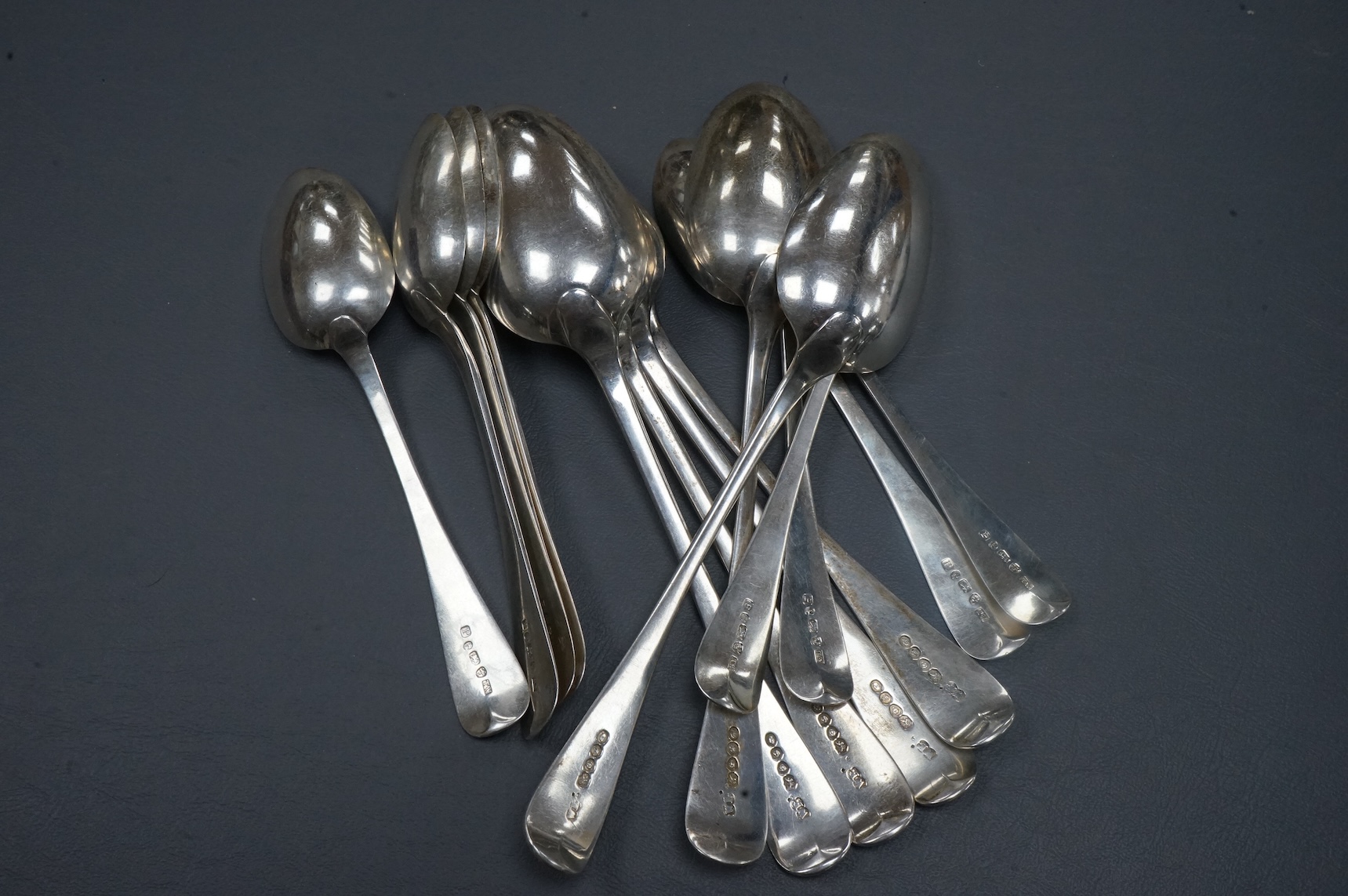 A set of six early Victorian silver Old English pattern table spoons, by William Bateman, London, 1837, 22.5cm, together with a set of eight provincial silver Old English pattern dessert spoons, Thomas Wheatley, Newcastl